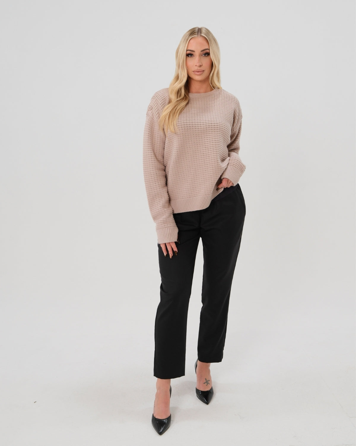 Taupe neutral premium sweater in stretch cotton box knit. Featuring shoulder button detail and discreet hem thumbholes for an extra cozy fit. Oversized fit is flattering, polished, and versatile. Petite and tall friendly; available in regular and plus size.