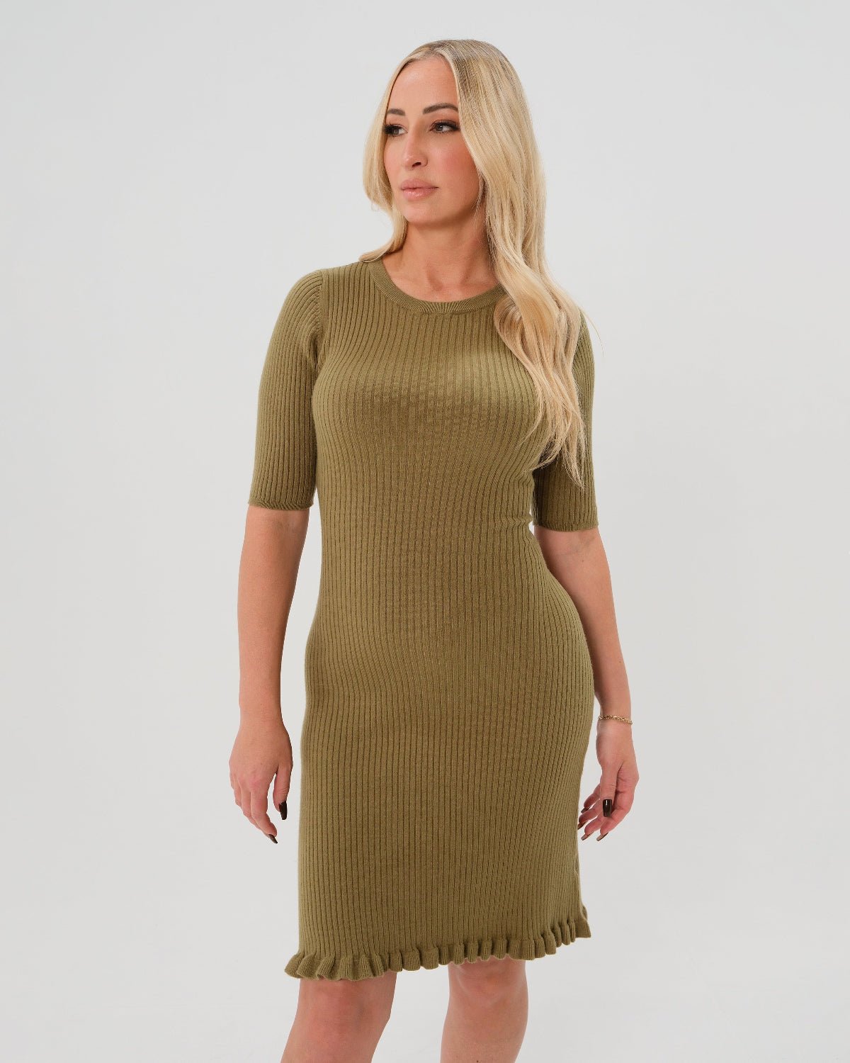 Olive green women's sweater dress with 3/4 sleeves, feminine ruffle hem detail, and luxurious cotton stretch knit. Perfect for work outfits, wedding guest, holiday parties, baby showers, and street style. Maternity friendly.