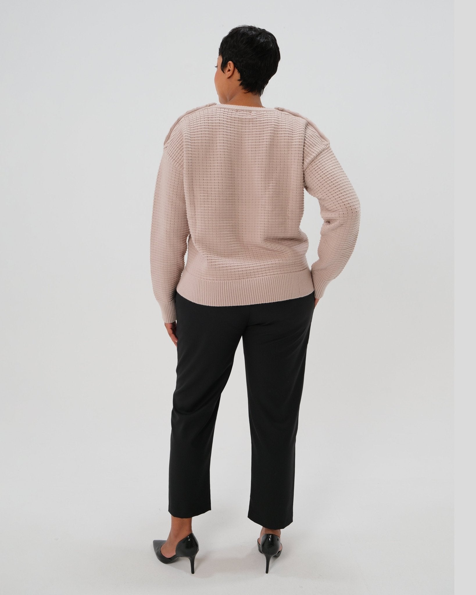Black plus size maternity pants, under belly style, cut in all-season wool blend with hidden flexible waist adjustment, deep pockets, and stylish straight leg. Maternity trousers cropped for tall mamas and full length for petite pregnant women. Postpartum friendly women's wear for business, wedding guest, dinner, and occasion.