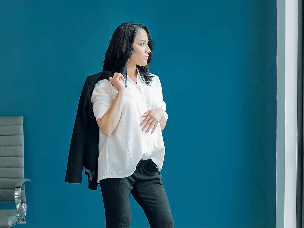 Best Maternity Clothes for Work, by MARION. White buttondown nursing top and black maternity pants.