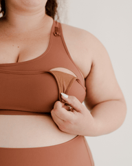Brown maternity and nursing sports and athleisure bra in luxe stretch nylon with easy breastfeeding clips and a stylish racerback design. Full support. Make a matching set with coordinating maternity bike short or maternity leggings. 