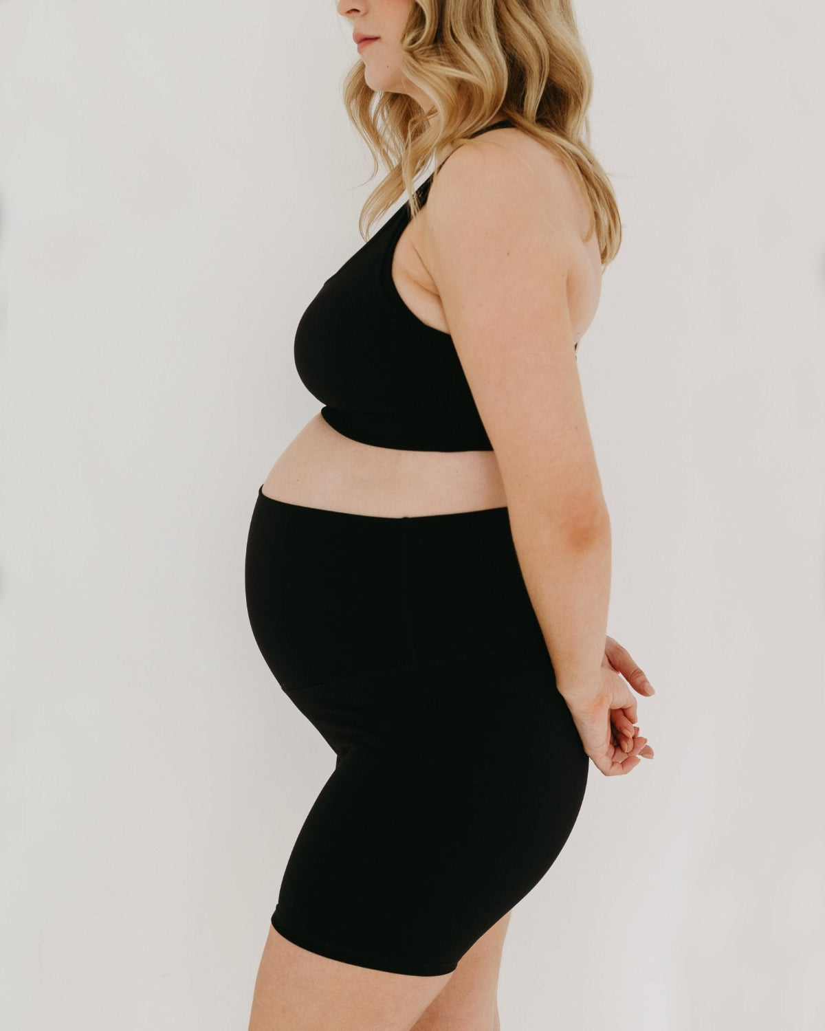 Black AXK Maternity high-impact, racerback pregnancy and nursing sports bra. Part of AXK&#39;s collection of premium maternity athletic and activewear and designer loungewear collections