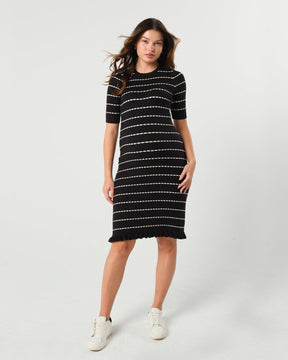 Striped knit maternity and nursing dress in black and white. Knee length three quarter sleeves with feminine hem detail. Ideal for maternity business workwear, date, church, wedding guest, brunch, and occasion. MARION luxury maternity workwear.