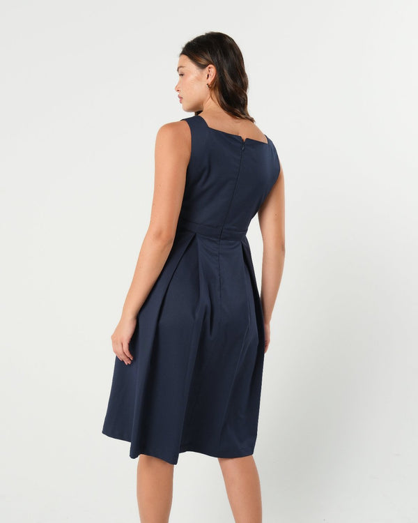 Luxury blue sleeveless maternity dress, from MARION's collection of elevated maternity and nursing dresses. Sustainable, available in standard and petite maternity sizes. Features designer breastfeeding access. Perfect maternity wedding guest dress, baby shower dress, or maternity tea party dress.