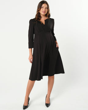 Black maternity and nursing empire dress for business, baby shower, wedding guest, party, and formal occasions. Sustainable TENCEL, zipper breastfeeding access, and full skirt with deep pockets. MARION offers the market's best maternity dresses in petite and standard sizes.