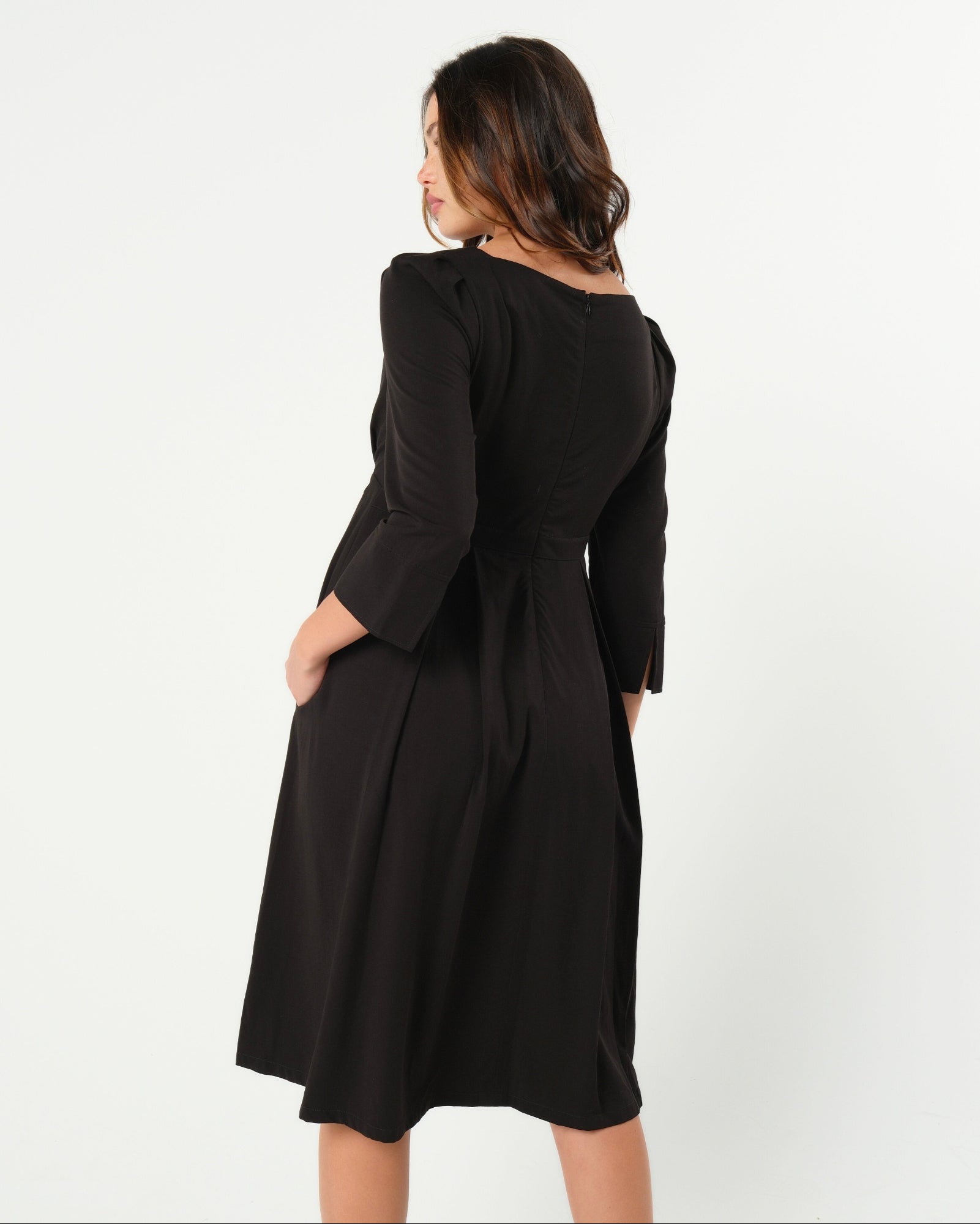 Black maternity and nursing empire dress for business, baby shower, wedding guest, party, and formal occasions. Sustainable TENCEL, zipper breastfeeding access, and full skirt with deep pockets. MARION offers the market's best maternity dresses in petite and standard sizes.