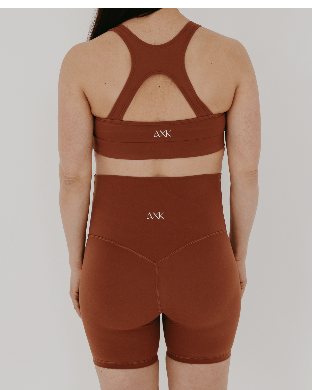 Terra cotta brown luxury maternity bike shorts with stretch belly band. Perfect for pregnancy and postpartum recovery and support. 