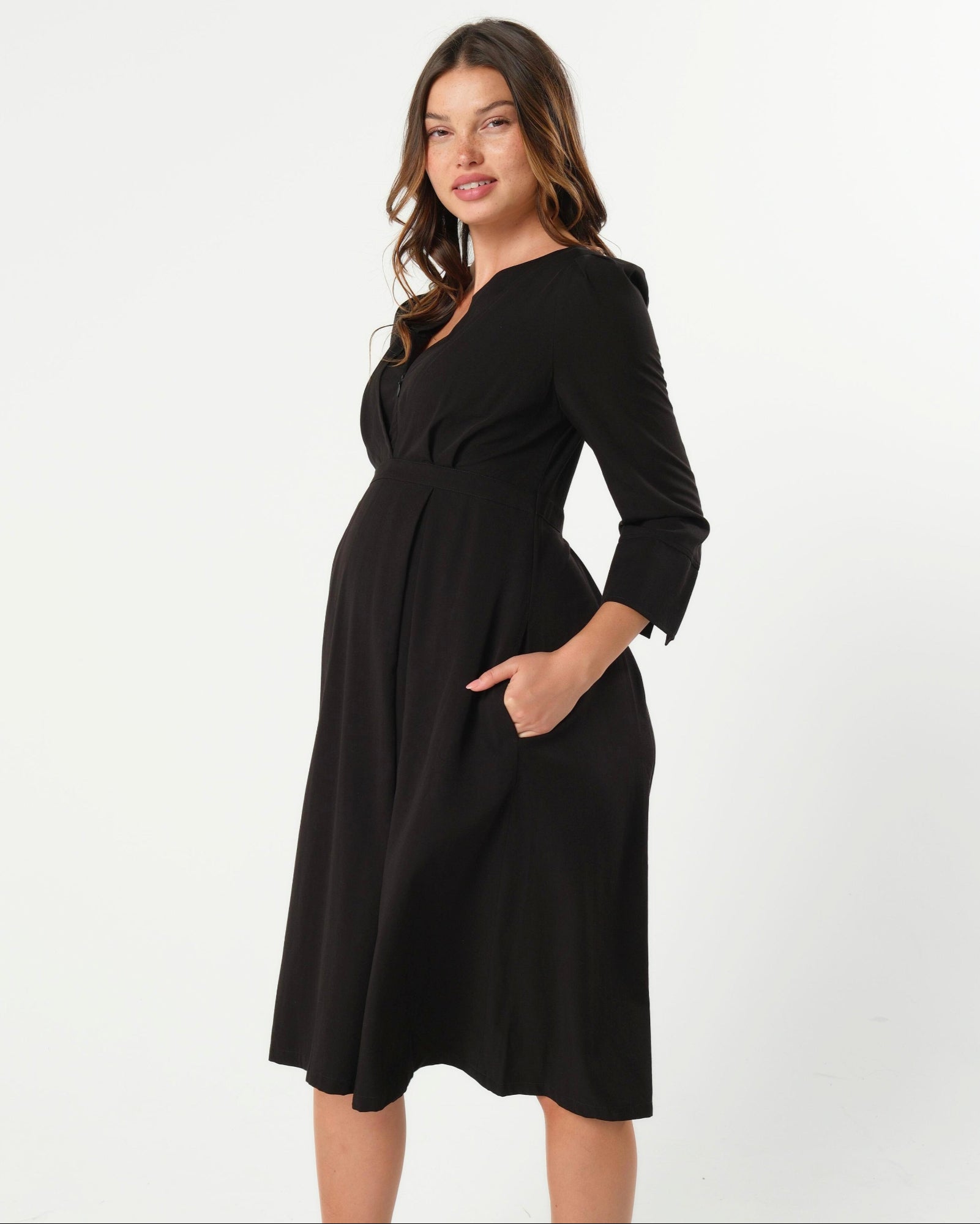 Black maternity and nursing empire dress for business, baby shower, wedding guest, party, and formal occasions. Sustainable TENCEL, zipper breastfeeding access, and full skirt with deep pockets. MARION offers the market's best maternity dresses in petite and standard sizes.