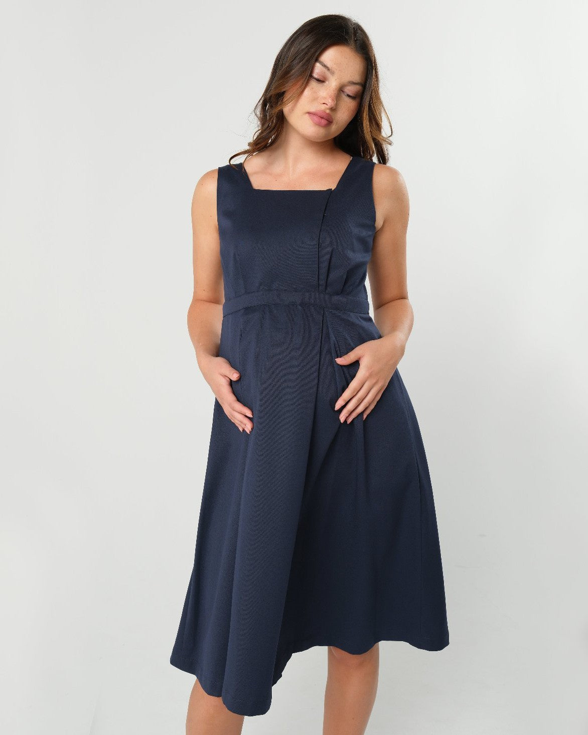 Luxury blue sleeveless maternity dress, from MARION's collection of elevated maternity and nursing dresses. Sustainable, available in standard and petite maternity sizes. Features designer breastfeeding access. Perfect maternity wedding guest dress, baby shower dress, or maternity tea party dress.