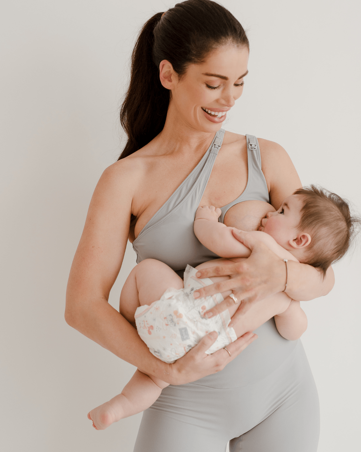 Light gray maternity and nursing bra made with exquisite, buttery fabric. Features a one-handed release for breastfeeding on the go. 