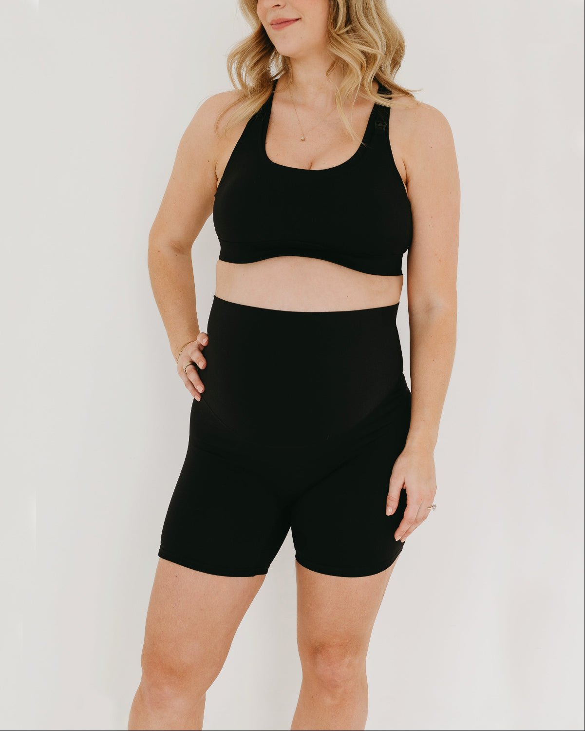 Black AXK Maternity high-impact, racerback pregnancy and nursing sports bra. Part of AXK&#39;s collection of premium maternity athletic and activewear and designer loungewear collections. 