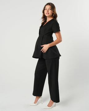 Black maternity wide leg dress pants for work with over belly band. Sustainable pregnancy business trousers cut with luxury Italian suiting fabric. Perfect maternity bottom separates for pregnancy pants suit.