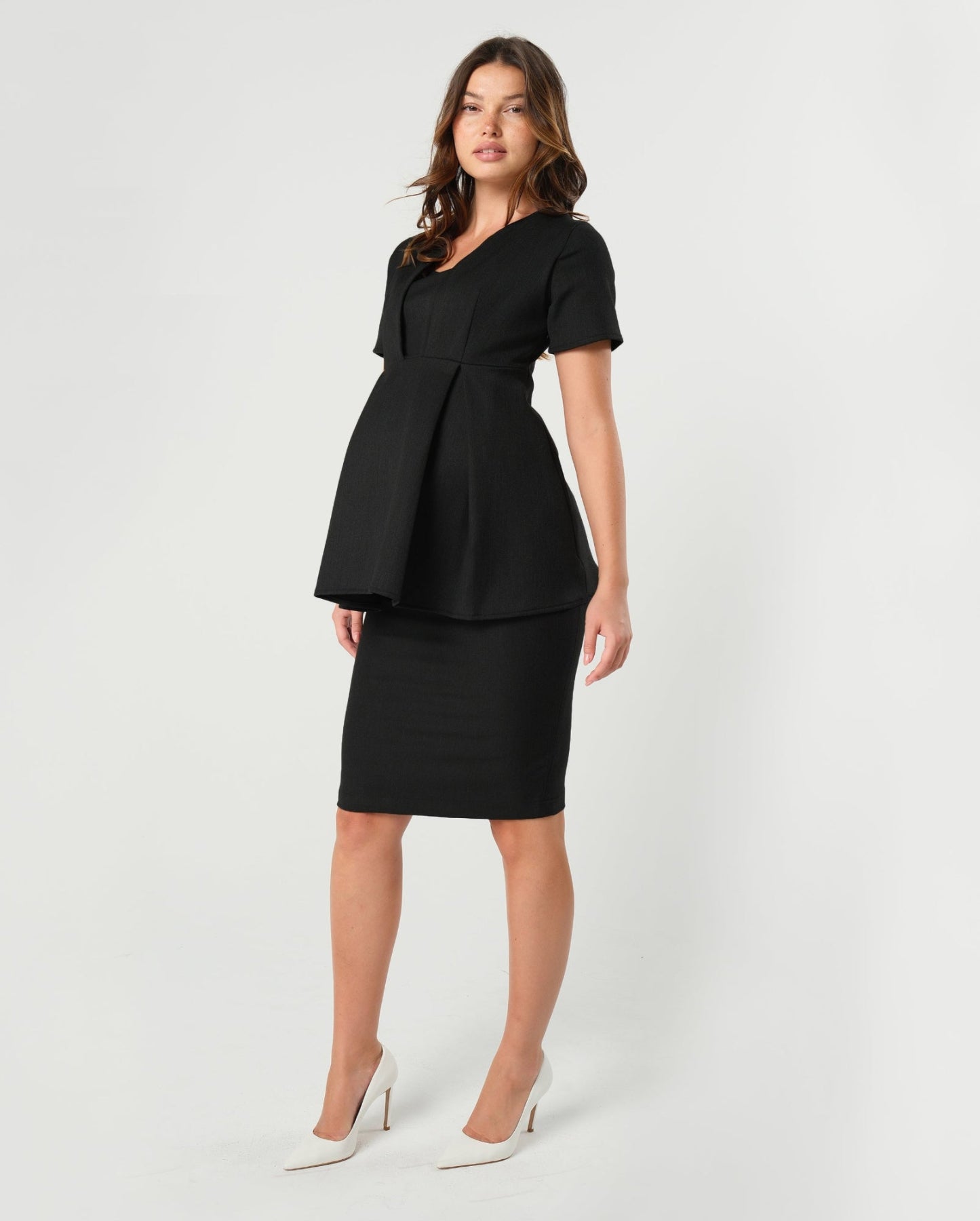 Premium quality black maternity pencil skirt by MARION. Best luxury corporate maternity business clothes for pregnant lawyers and executives. Best sustainable, washable, travel friendly workwear for 2026.