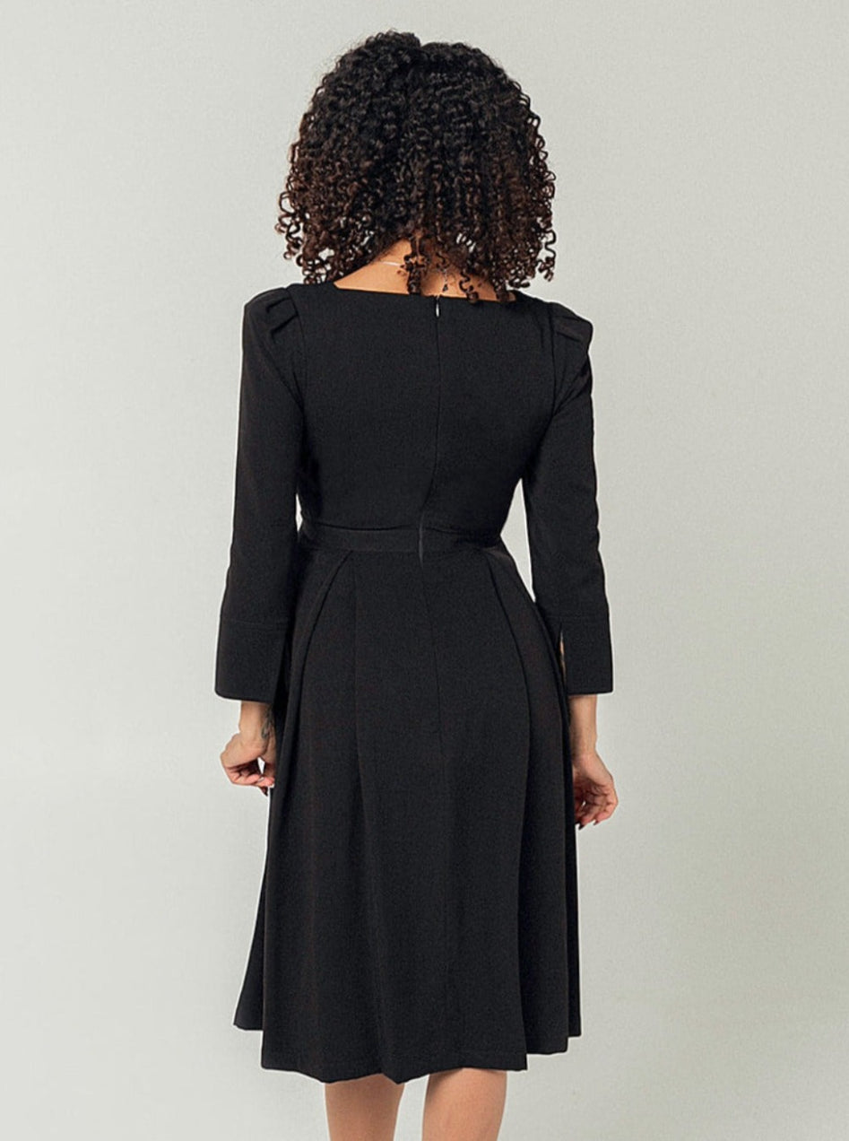 Black maternity and nursing dresses by MARION. Sustainable TENCEL empire waist style with deep pockets and full feminine skirt. Breastfeeding friendly with 3/4 sleeves and elegant cuff detail. Petite sizing also available.