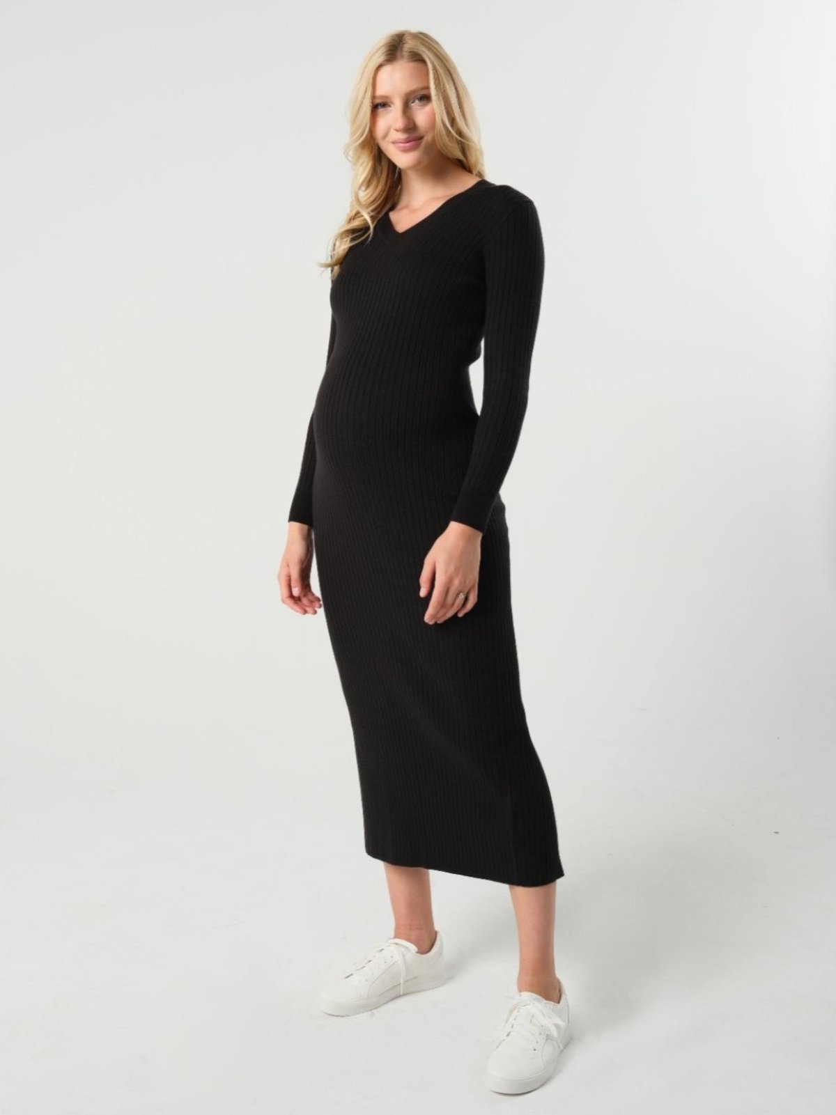 Black maternity sweater dress with discreet nursing access. Long knit maternity office wear dress is petite friendly and fits tall mamas like a midi dress. Perfect for baby shower, maternity guest, or business attire. MARION is luxury maternity fashion. 