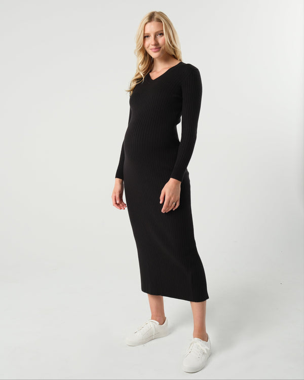 Black maternity sweater dress with discreet nursing access. Long knit maternity office wear dress is petite friendly and fits tall mamas like a midi dress. Perfect for baby shower, maternity guest, or business attire. MARION offers the best in luxury maternity fashion. 