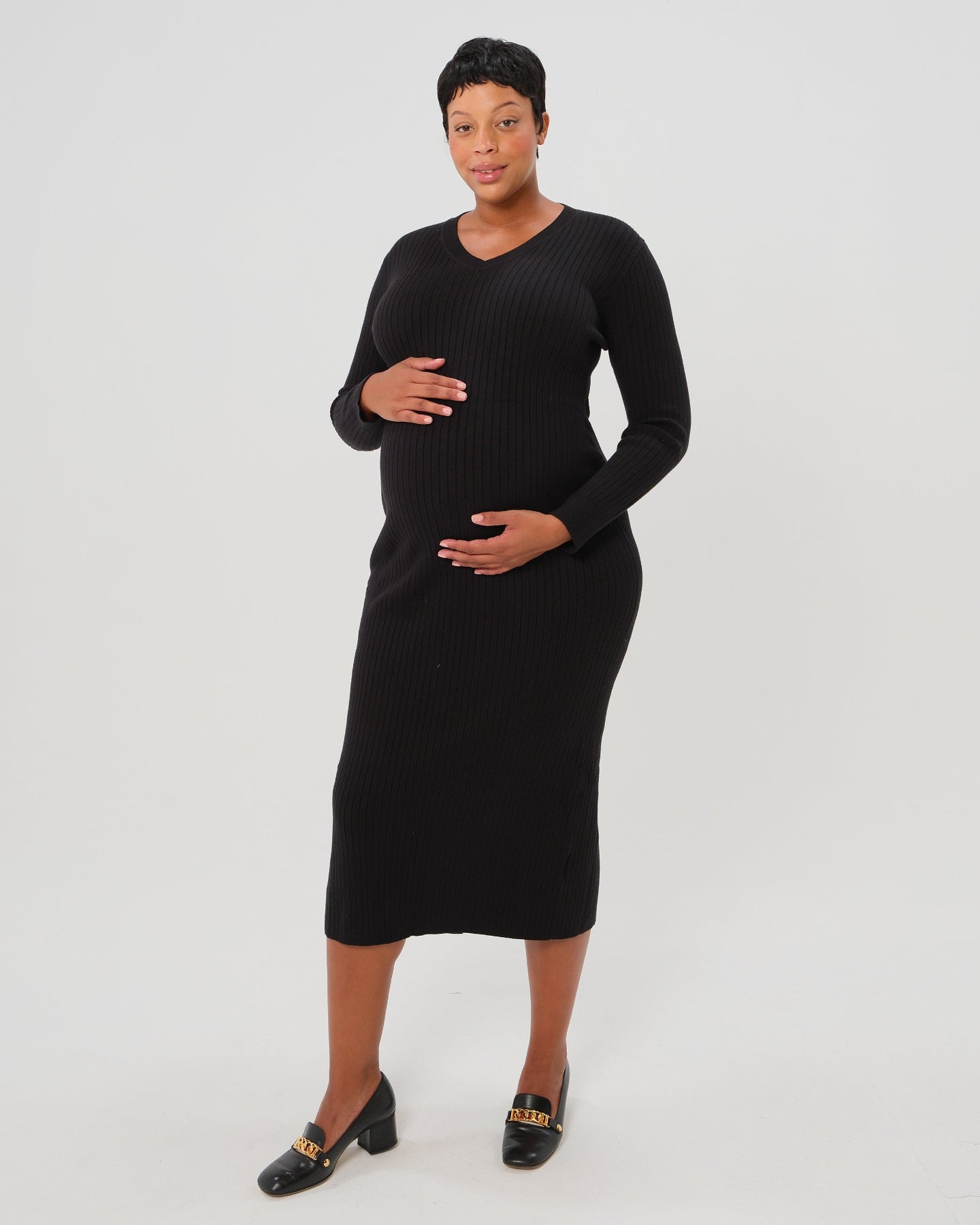 Plus size pregnant model wearing MARION's premium quality black maternity sweater dress. Designed with discreet nursing access, this long sleeve knit maternity dress has 100% 5-star reviews, is petite friendly, and fits tall mamas like a midi dress. Perfect for baby shower, wedding guest, or business attire. 

MARION offers the best elevated, flattering maternity dresses of 2026 for work, your baby shower, wedding guest outfits, party and occasion wear, or church. Offered by Nordstrom & Bloomingdale's. 