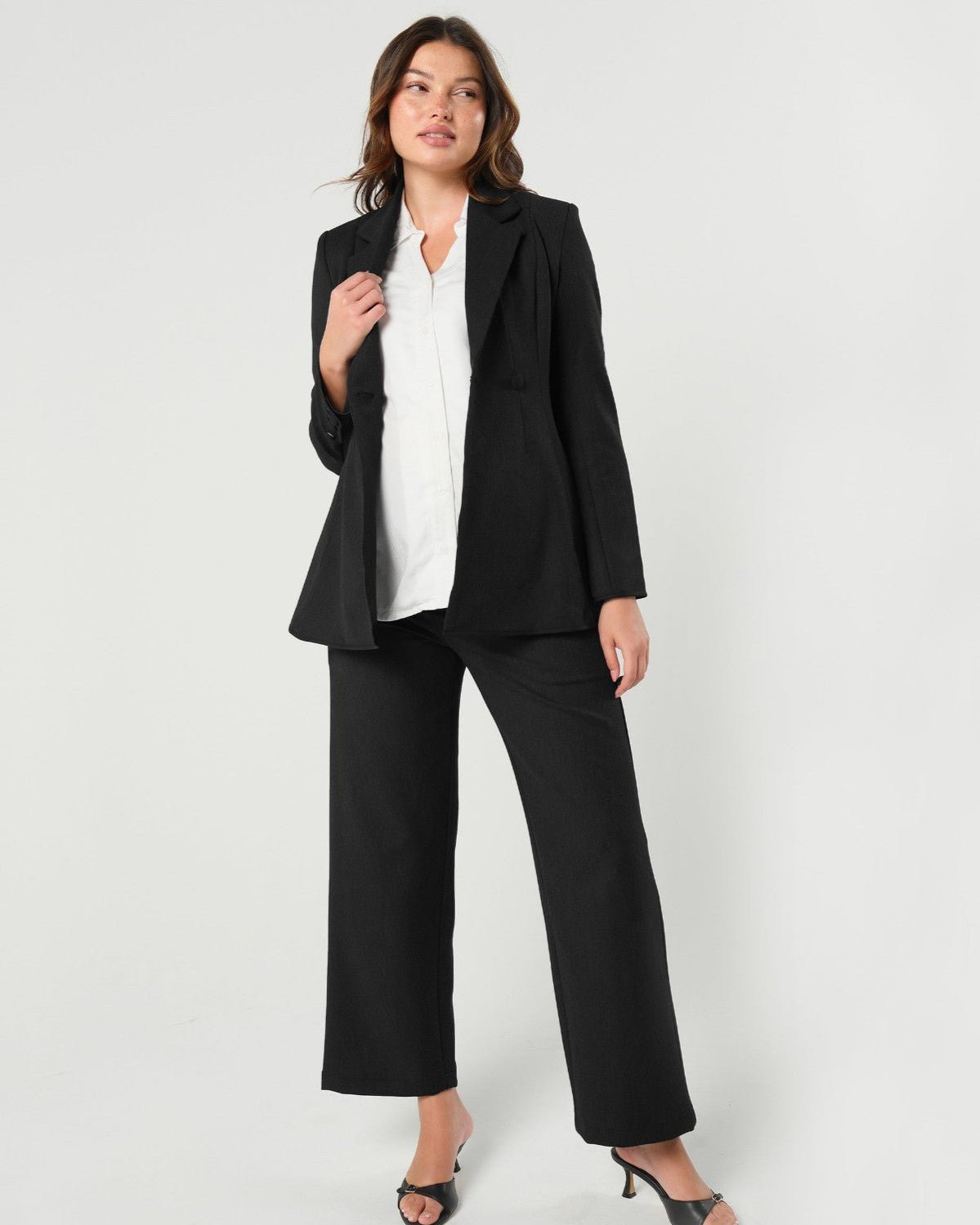 Black maternity blazer suit jacket in luxury Italian stretch suiting fabric. Empire waist pant suit separates for your best pregnancy, breastfeeding, and postpartum fit. Petite and regular sizes. 38% sustainable recycled fibers. Also sold by Nordstrom, Bloomingdale&#39;s, and Macy&#39;s maternity. 