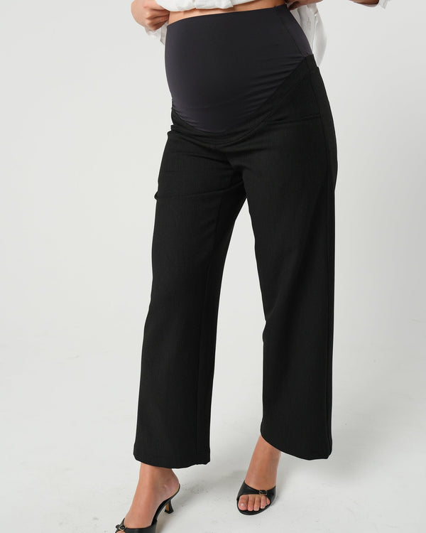 Black maternity wide leg dress pant with over belly band. Sustainable pregnancy business trousers cut with Italian suiting fabric. 