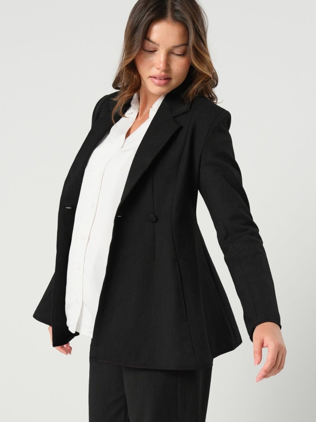 Black maternity blazer suit jacket in luxury Italian stretch suiting fabric. Empire waist pant suit separate for your best pregnancy, breastfeeding, and postpartum fit. Petite and regular sizes. 38% sustainable recycled fibers. Also sold by Nordstrom, Bloomingdale's, and Macy's maternity. 