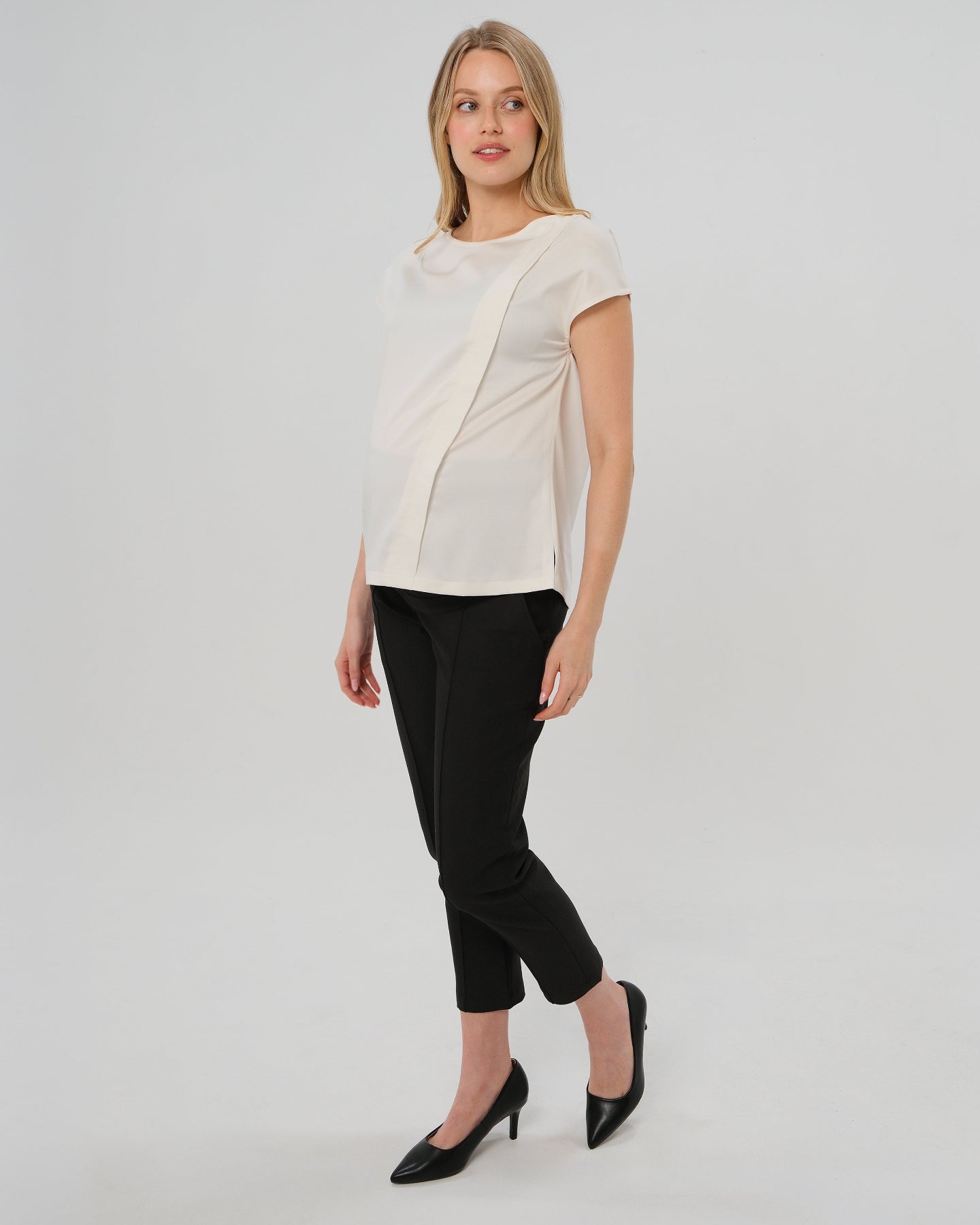 Best selling formal black maternity work pants by MARION. These 2026 core season slacks for the office, courtroom, or business casual needs feature a tailored, slimming design and are cut with luxury Italian stretch suiting fabric. Shop our petite and tall friendly, sustainable, and washable pregnancy suiting trousers that earn glowing 5-star customer reviews. Premium maternity business attire. 