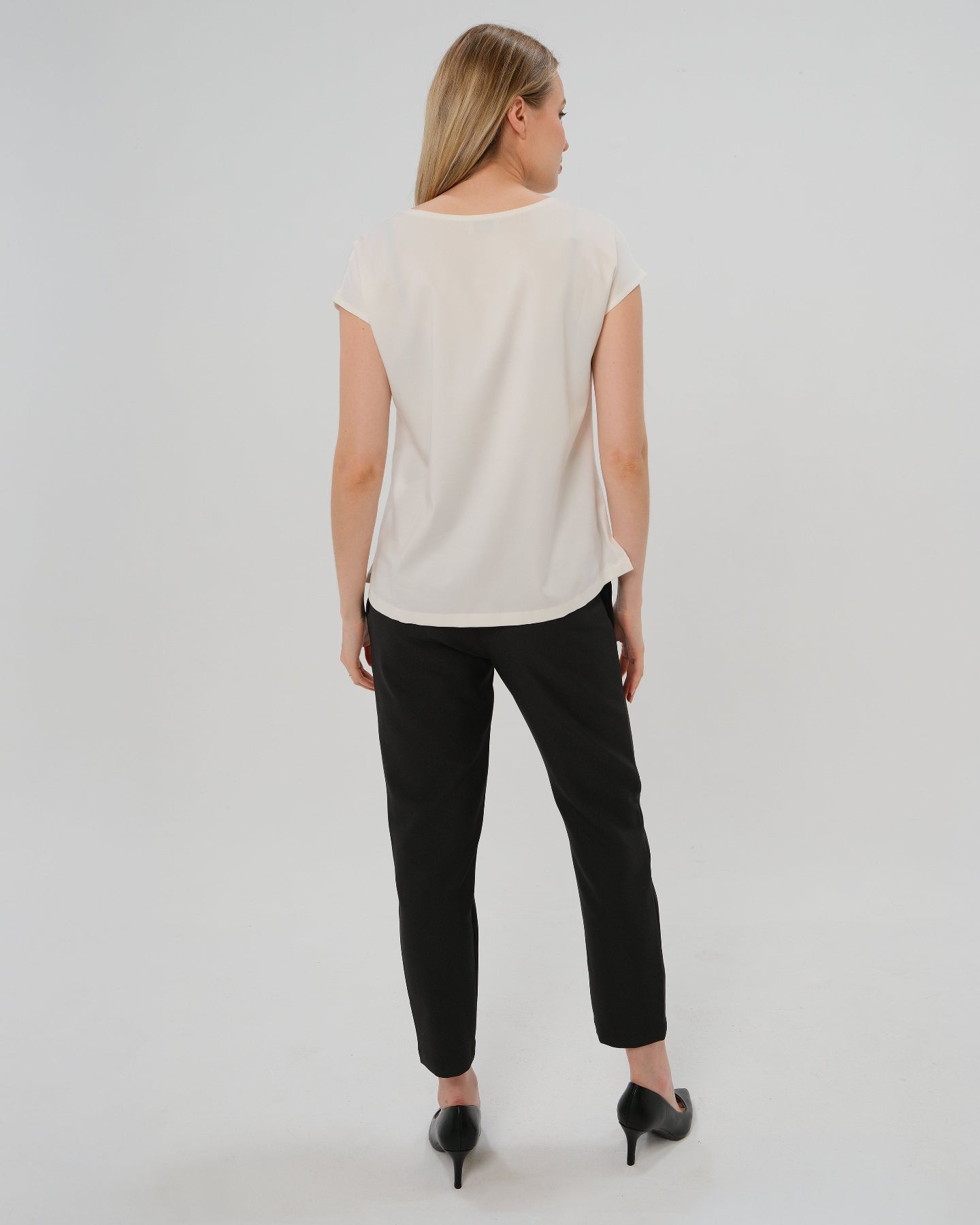 Best selling formal black maternity work pants by MARION. These 2026 core season slacks for the office, courtroom, or business casual needs feature a tailored, slimming design and are cut with luxury Italian stretch suiting fabric. Shop our petite and tall friendly, sustainable, and washable pregnancy suiting trousers that earn glowing 5-star customer reviews. Premium maternity business attire. 