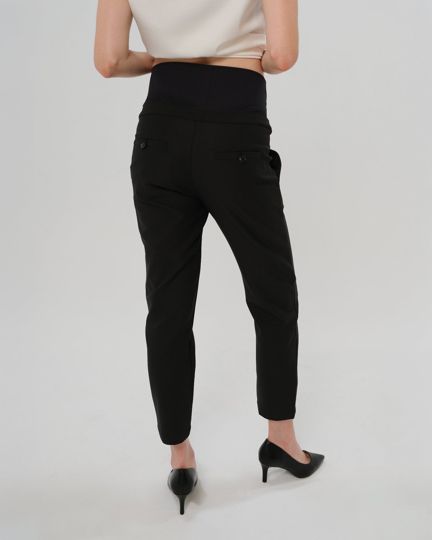 Best selling formal black maternity work pants by MARION. These 2026 core season slacks for the office, courtroom, or business casual needs feature a tailored, slimming design and are cut with luxury Italian stretch suiting fabric. Shop our petite and tall friendly, sustainable, and washable pregnancy suiting trousers that earn glowing 5-star customer reviews. Premium maternity business attire. 