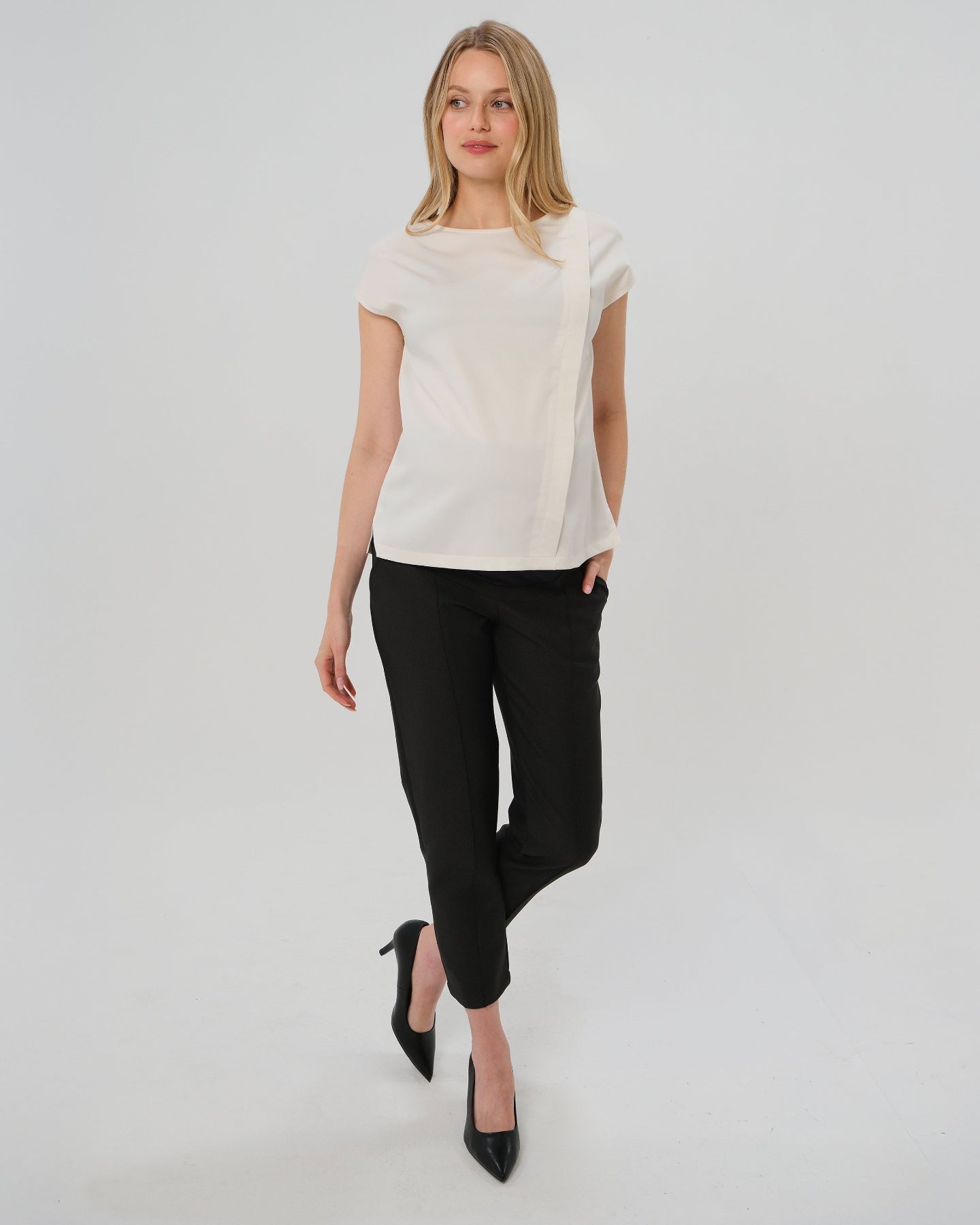 Best selling formal black maternity work pants by MARION. These 2026 core season slacks for the office, courtroom, or business casual needs feature a tailored, slimming design and are cut with luxury Italian stretch suiting fabric. Shop our petite and tall friendly, sustainable, and washable pregnancy suiting trousers that earn glowing 5-star customer reviews. Premium maternity business attire. 