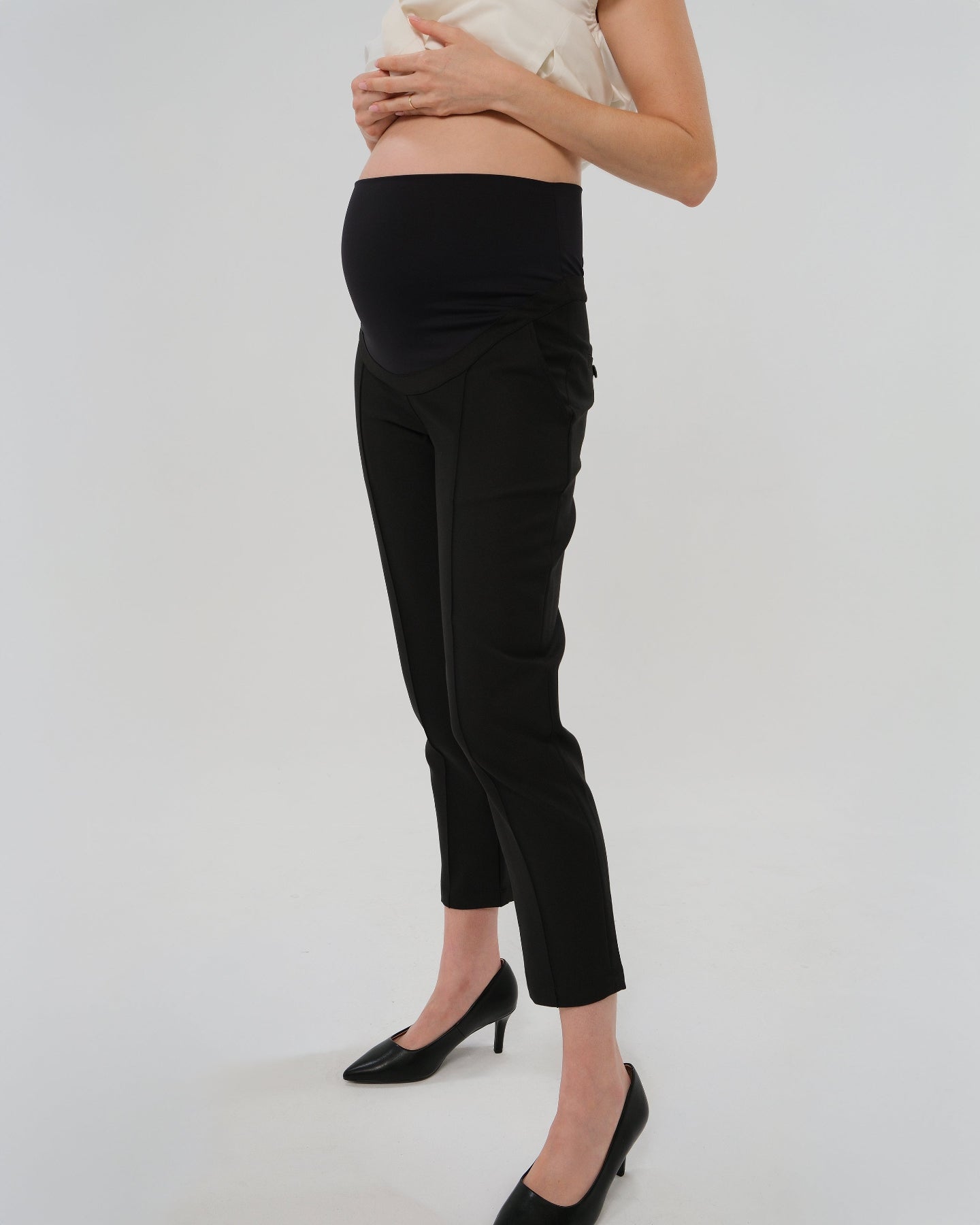 Best selling formal black maternity work pants by MARION. These 2026 core season slacks for the office, courtroom, or business casual needs feature a tailored, slimming design and are cut with luxury Italian stretch suiting fabric. Shop our petite and tall friendly, sustainable, and washable pregnancy suiting trousers that earn glowing 5-star customer reviews. Premium maternity business attire. 