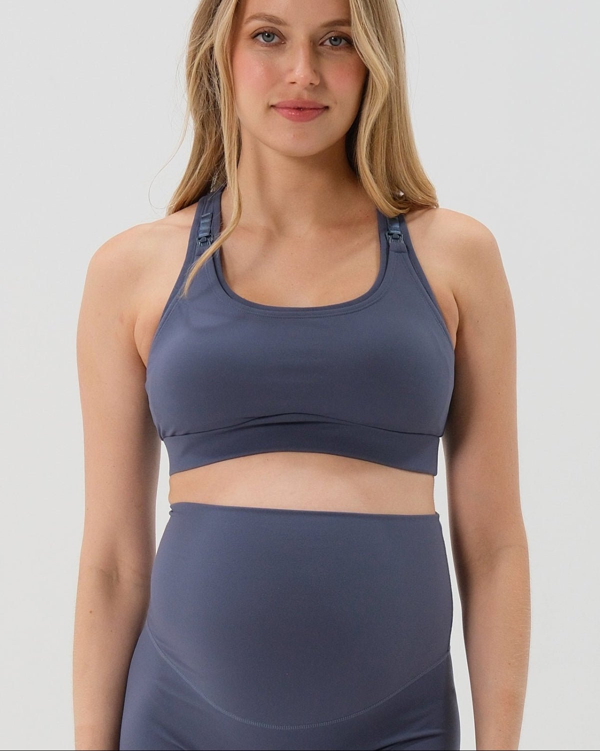 Blue AXK Maternity high-impact, racerback pregnancy and nursing sports bra. Part of AXK's collection of premium maternity athletic and activewear and designer loungewear collections. 