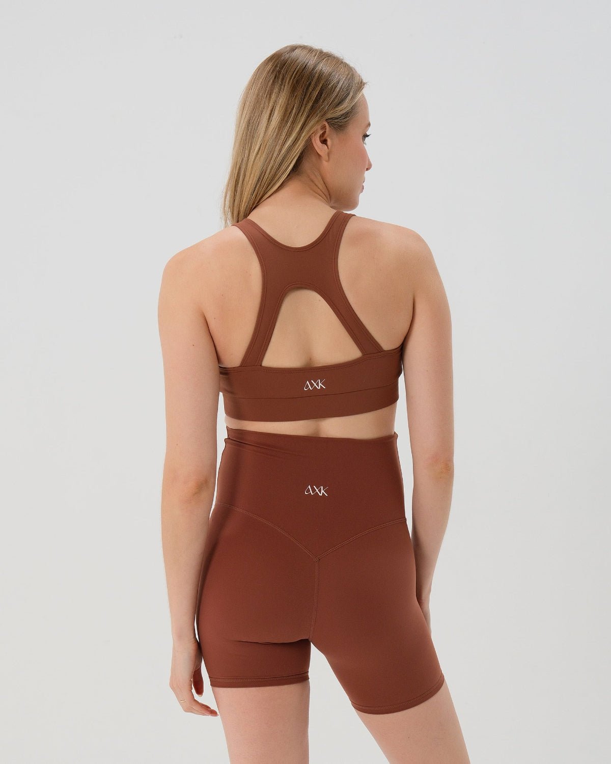Brown AXK Maternity high-impact, racerback pregnancy and nursing sports bra. Part of AXK's collection of premium maternity athletic and activewear and designer loungewear collections. 