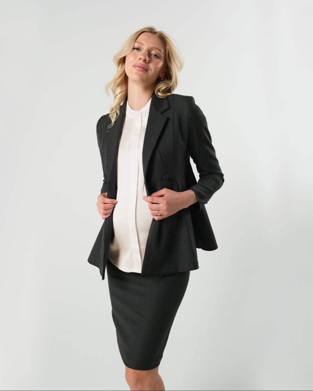 Black maternity blazer suit jacket in luxury Italian stretch suiting fabric. Empire waist pant suit separate for your best pregnancy, breastfeeding, and postpartum fit. Petite and regular sizes. 38% sustainable recycled fibers. Also sold by Nordstrom, Bloomingdale's, and Macy's maternity. 