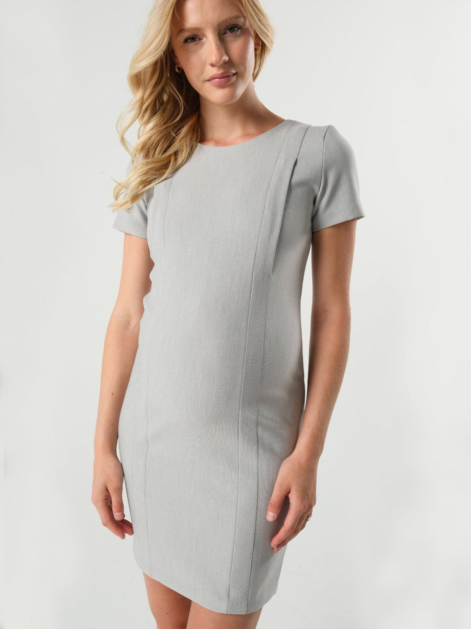 Light gray maternity and nursing dress for work. Maternity business apparel by MARION. Nursing dress for office with hidden breastfeeding zipper. Luxury, sustainable Italian suiting fabric, short sleeves, round neckline. Petite friendly, best maternity workwear.