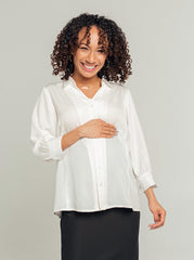 White maternity button down shirt for pregnancy and nursing. Maternity workwear top with no gap technology. Cut with luxury sustainable TENCEL for the office, the courtroom, or Saturday errands.