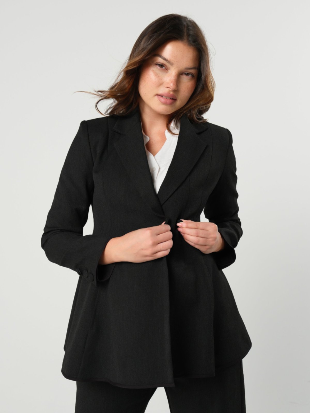 Black maternity blazer suit jacket in luxury Italian stretch suiting fabric. Empire waist separates for your best pregnancy, breastfeeding, and postpartum fit. Petite and regular sizes. 38% sustainable recycled fibers. Also sold by Nordstrom, Bloomingdale's, and Macy's maternity. 