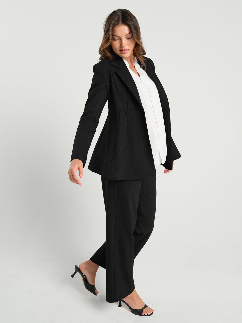 Black maternity blazer suit jacket in luxury Italian stretch suiting fabric. Empire waist pant suit separate for your best pregnancy, breastfeeding, and postpartum fit. Petite and regular sizes. 38% sustainable recycled fibers. Also sold by Nordstrom, Bloomingdale's, and Macy's maternity. 