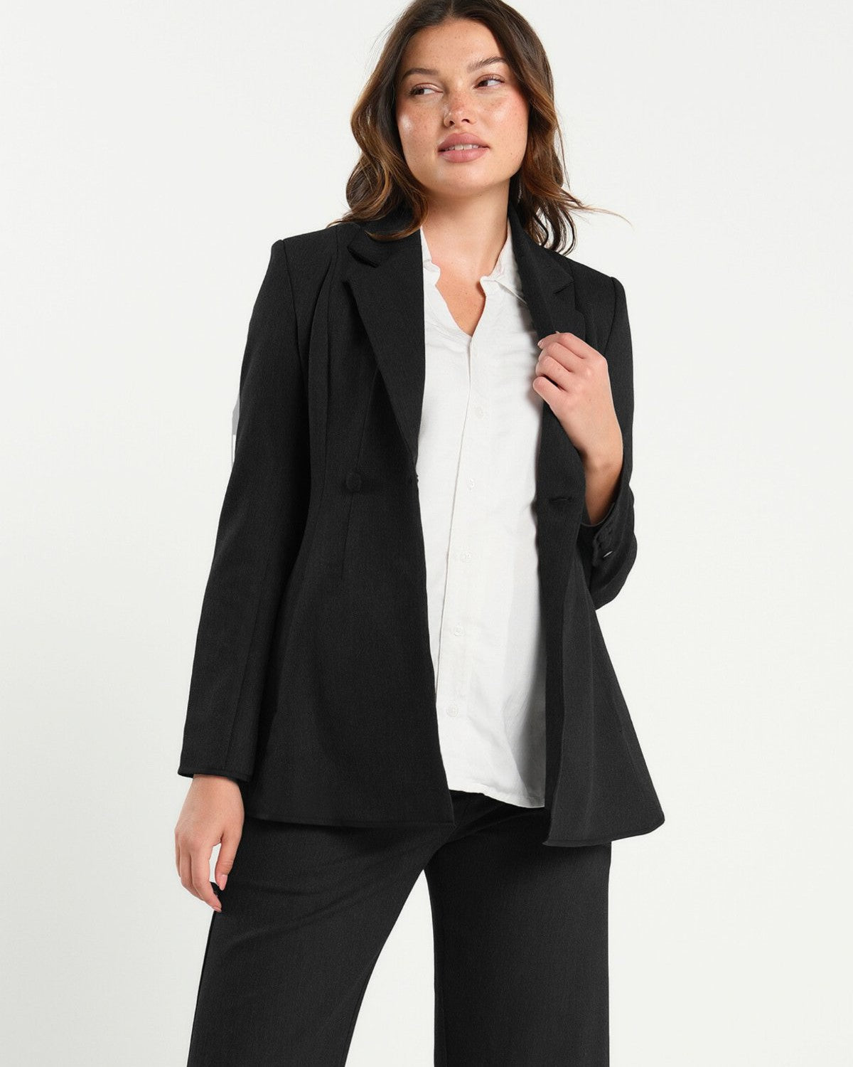Black maternity blazer suit jacket in luxury Italian stretch suiting fabric. Empire waist separates for your best pregnancy, breastfeeding, and postpartum fit. Petite and regular sizes. 38% sustainable recycled fibers. Also sold by Nordstrom, Bloomingdale's, and Macy's maternity. 