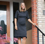Striped knit maternity and nursing dress in black and white. This knee length dress features three-quarter length sleeves with a feminine hem detail. Ideal for maternity business workwear, date night, church, a wedding guest outfit, brunch, and occasion. Petite and tall friendly. MARION offers the best luxury maternity workwear and fashion on the market.