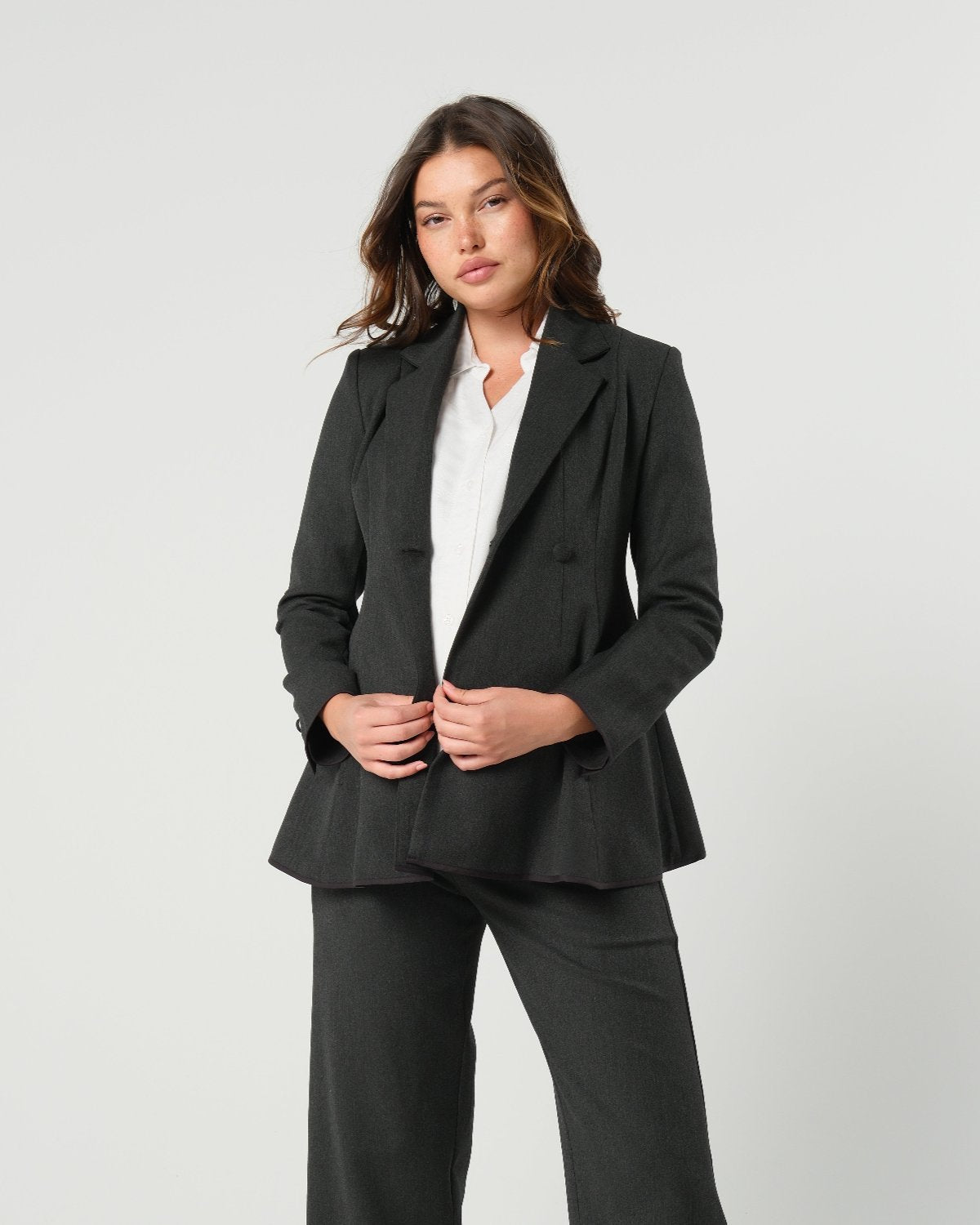 Charcoal gray maternity blazer suit jacket in luxury Italian stretch suiting fabric. Empire waist pant suit separates for your best pregnancy, breastfeeding, and postpartum fit. Petite and regular sizes. 38% sustainable recycled fibers. Also sold by Nordstrom, Bloomingdale's, and Macy's maternity. 