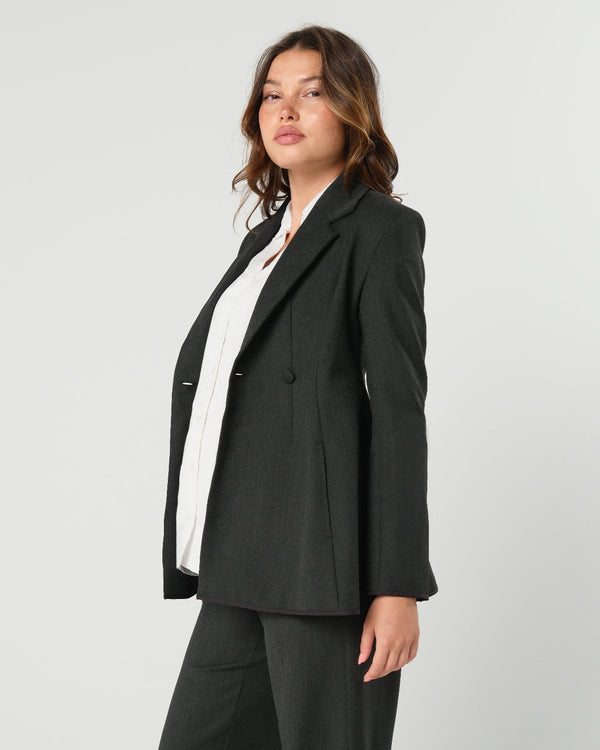 Charcoal gray maternity blazer suit jacket in luxury Italian stretch suiting fabric. Empire waist pant suit separates for your best pregnancy, breastfeeding, and postpartum fit. Petite and regular sizes. 38% sustainable recycled fibers. Also sold by Nordstrom, Bloomingdale's, and Macy's maternity. 