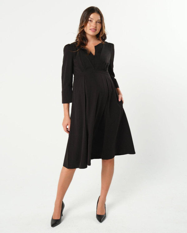 Black maternity and nursing empire dress for business, baby shower, wedding guest, party, and formal occasions. Sustainable TENCEL, zipper breastfeeding access, and full skirt with deep pockets. Petite and standard sizes.