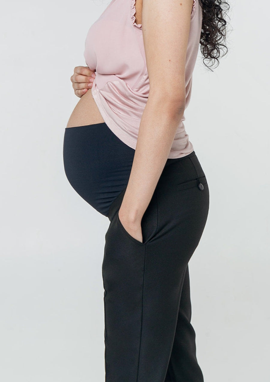 Black maternity workwear pants with stretch belly for bump comfort. Made with luxury stretch Italian suiting fabric. Featuring real pockets and slimming princess seams. Washable, sustainable, petite friendly pants.