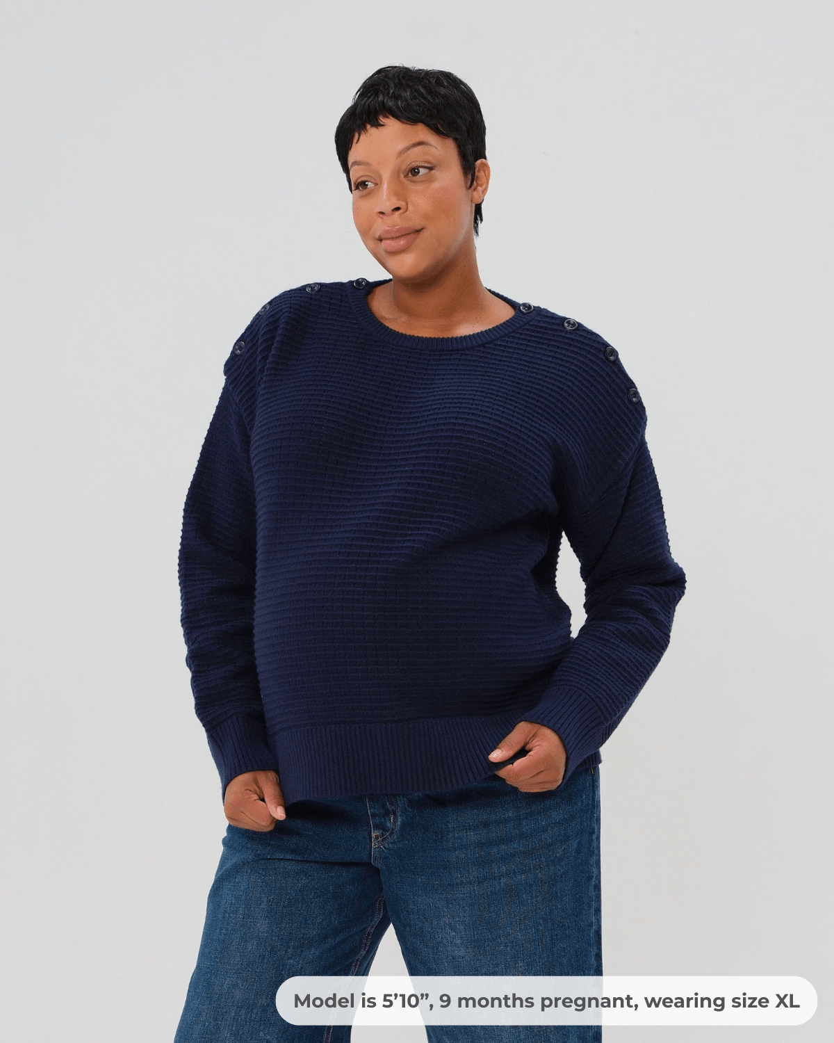 Navy premium maternity and nursing sweater in stretch cotton box knit. Featuring shoulder button detail for breastfeeding and discreet hem thumbholes for an extra cozy fit, our 5-star reviews for best maternity sweater are no surprise. This sweater's oversized fit is flattering, polished, and versatile - transitioning from pregnancy workwear to loungewear to streetwear with ease. Petite and tall friendly; available in regular and plus sizes in 2026. 