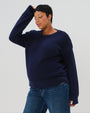 Navy premium maternity and nursing sweater in stretch cotton box knit. Featuring shoulder button detail for breastfeeding and discreet hem thumbholes for an extra cozy fit, our 5-star reviews for best maternity sweater are no surprise. This sweater's oversized fit is flattering, polished, and versatile - transitioning from pregnancy workwear to loungewear to streetwear with ease. Petite and tall friendly; available in regular and plus sizes in 2026. 