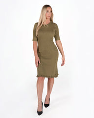 Mama model wearing MARION olive green knit luxury maternity and postpartum sweater dress. Knee length with feminine hem detail, 3/4 sleeves, and crew neck. Made with high quality, comfortable cotton stretch knit. Petite and tall friendly, for work, wedding guest, baby shower, street style, party, or date night. Not a nursing style. 