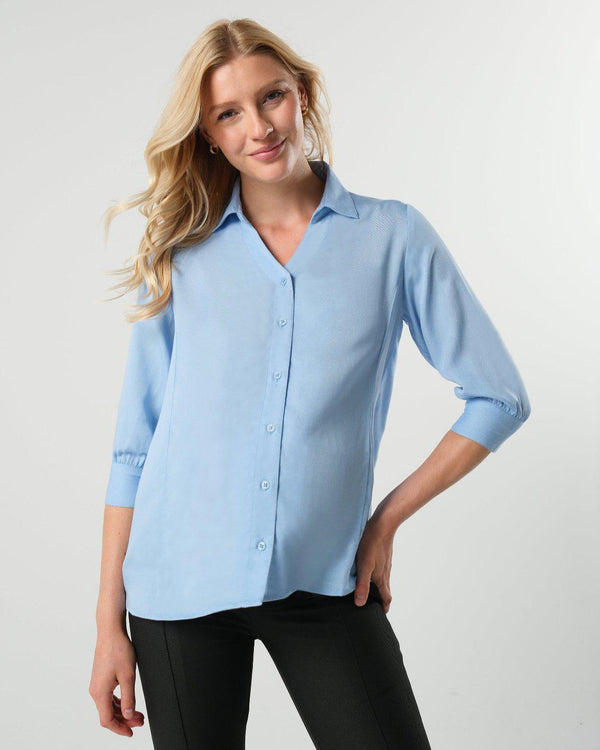 Pale blue maternity and nursing button down shirt by MARION. Sustainable TENCEL maternity business top in regular and petite sizing. Luxury pregnancy workwear. 