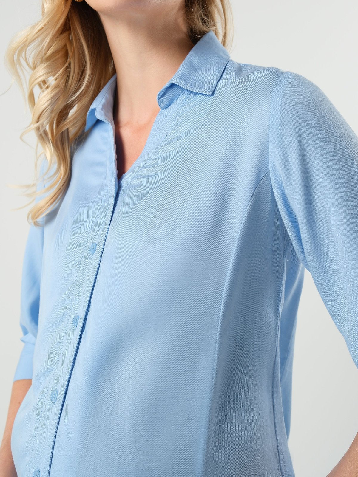 Pale blue maternity and nursing button down shirt by MARION. Sustainable TENCEL maternity business top in regular and petite sizing. Luxury pregnancy workwear. 