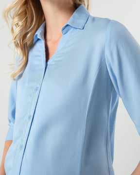 Pale blue maternity and nursing button down shirt by MARION. Sustainable TENCEL maternity business top in regular and petite sizing. Luxury pregnancy workwear. 