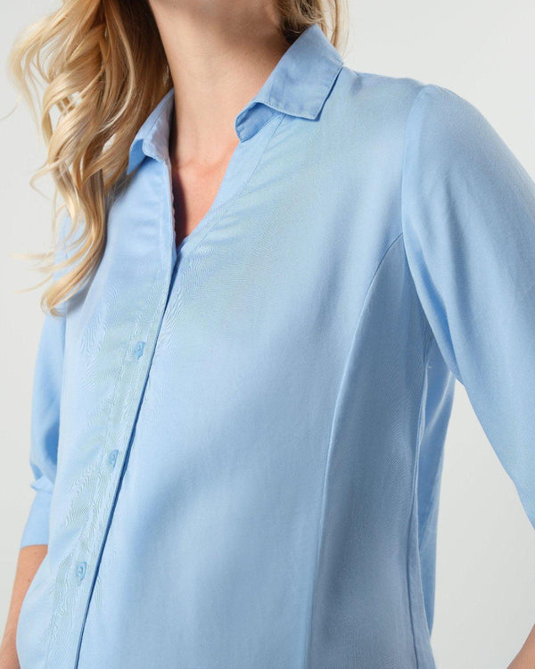 Pale blue maternity and nursing button down shirt by MARION. Sustainable TENCEL maternity business top in regular and petite sizing. Luxury pregnancy workwear. 