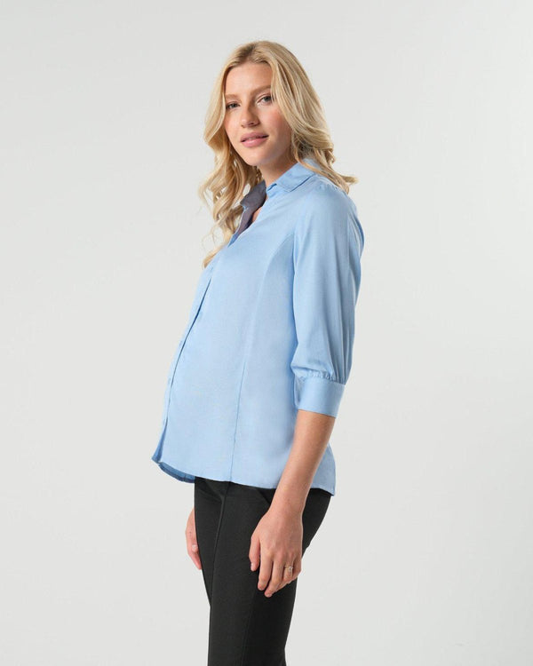 Pale blue maternity and nursing button down shirt by MARION. Sustainable TENCEL maternity business top in regular and petite sizing. Luxury pregnancy workwear. 